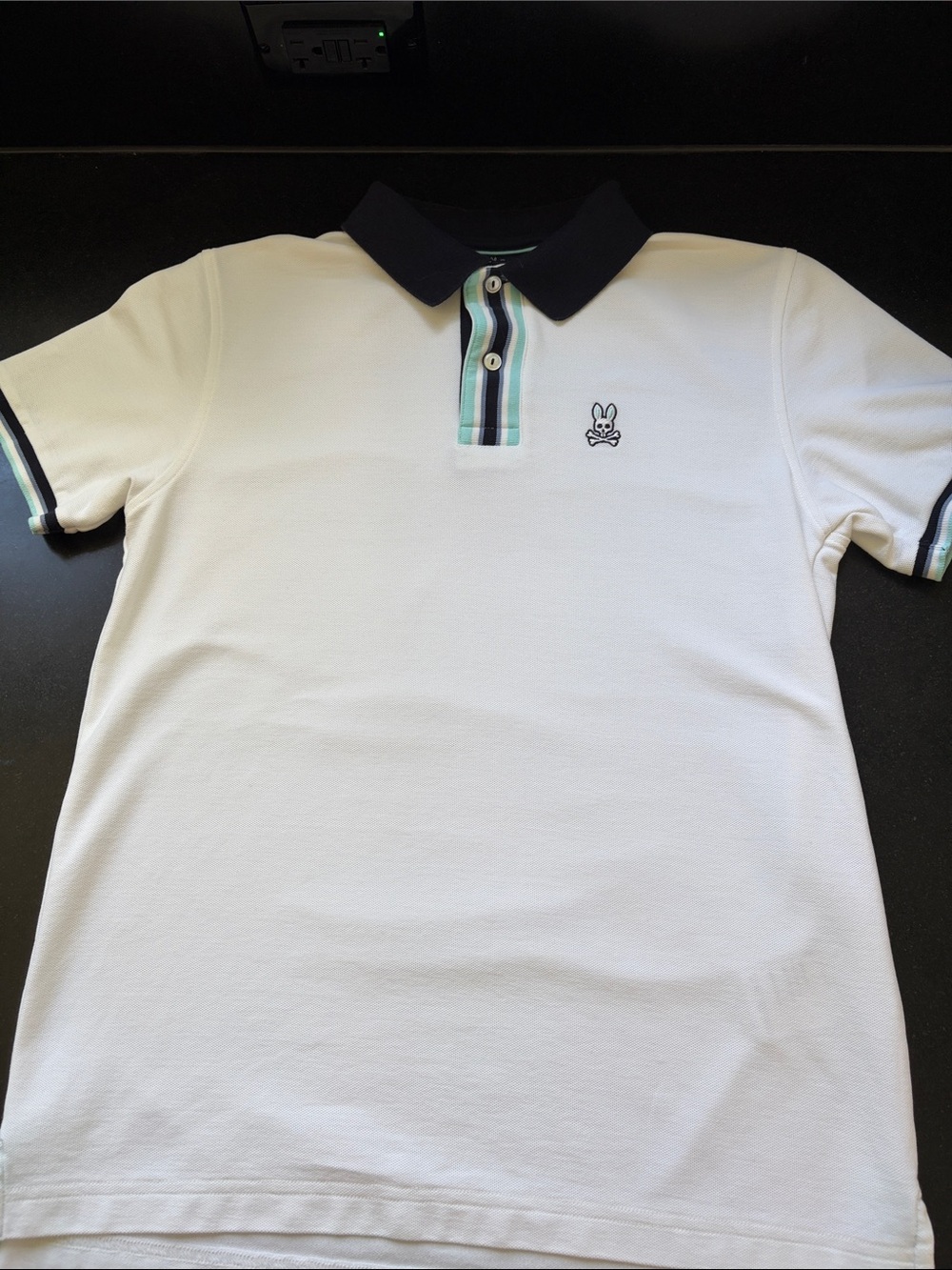 Psycho Bunny White Polo with Navy Collar and Mint-Strip Placket